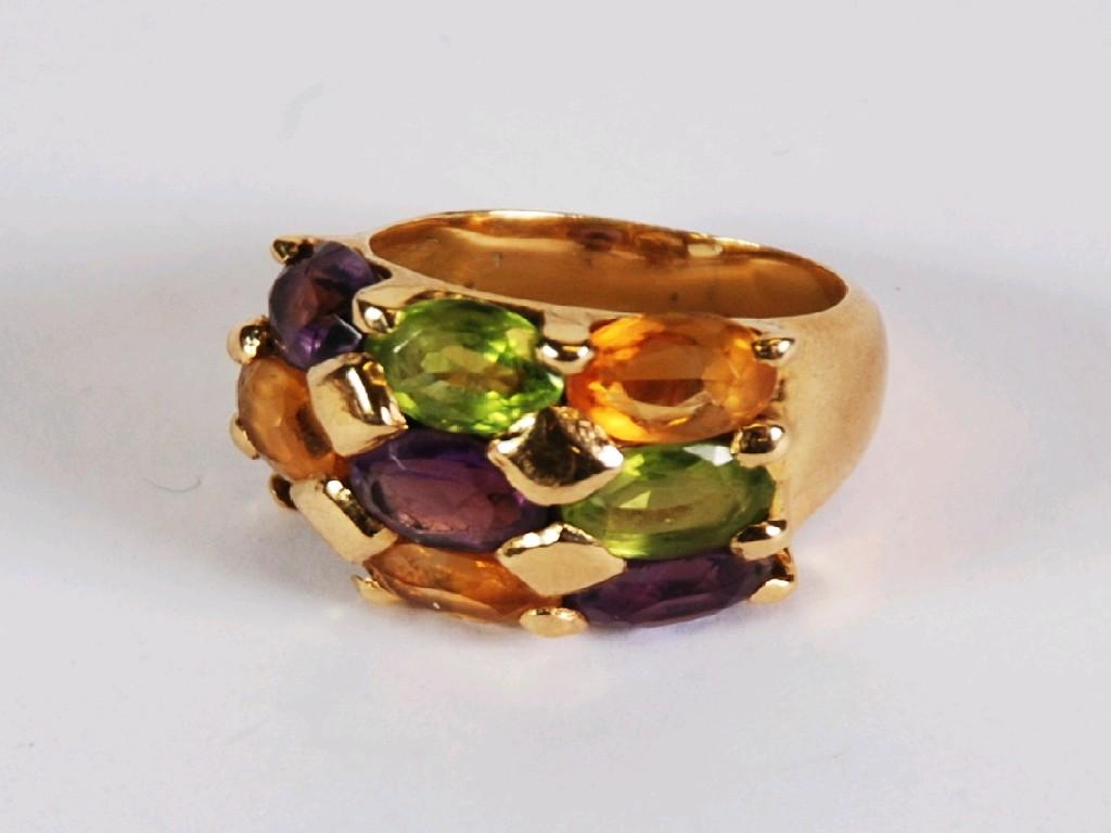 Appraisal: GOLD DRESS RING set with eight oval semi precious stones