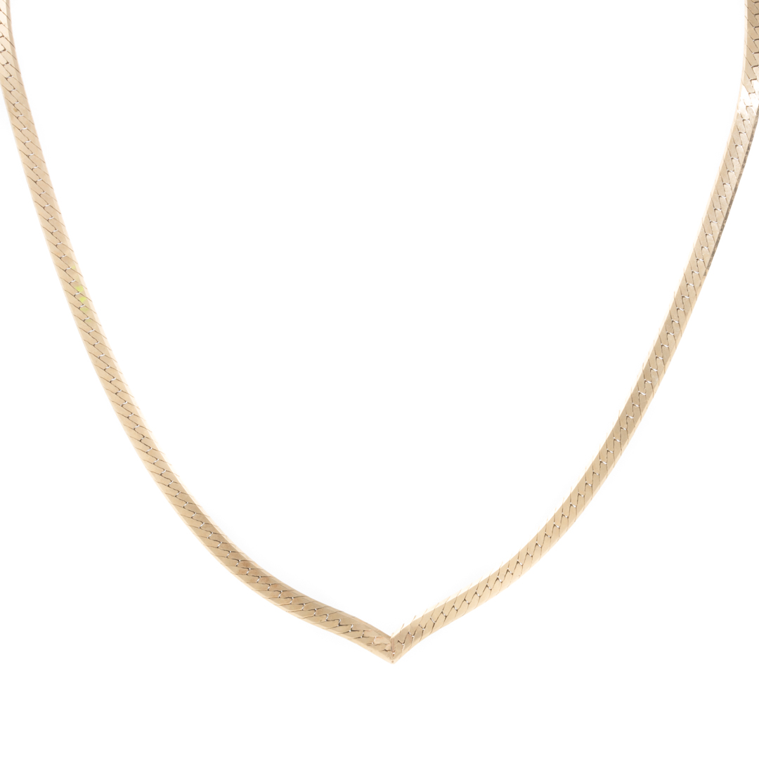 Appraisal: A Lady's K Herringbone V Necklace K yellow gold herringbone