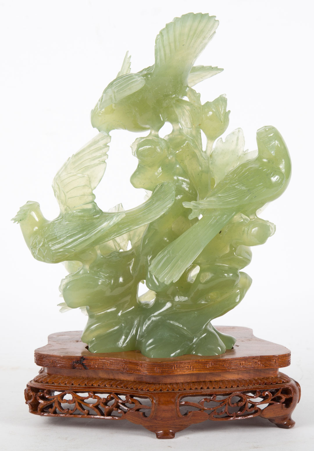 Appraisal: Chinese carved jade bird group mounted on fitted wood base