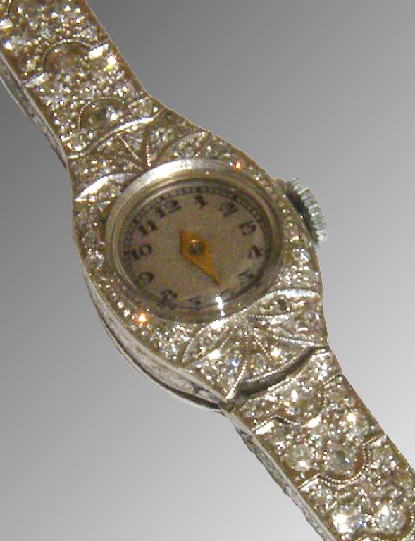 Appraisal: 's platinum diamond set lady's cocktail watch the circular silvered