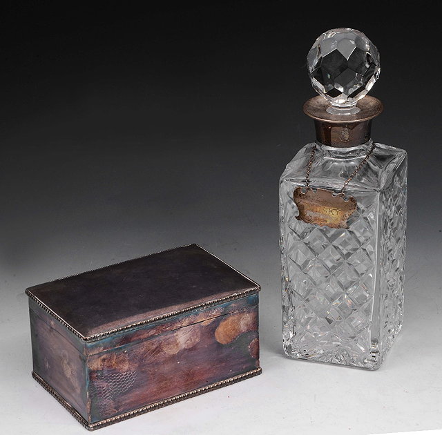 Appraisal: A HEAVY GLASS SPIRIT DECANTER AND STOPPER with silver collar