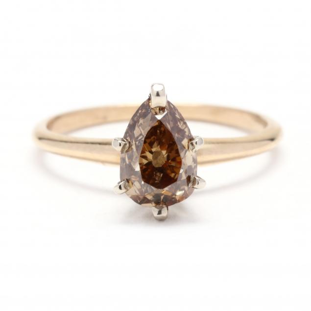 Appraisal: GOLD AND PEAR CUT DIAMOND RING Centered on a pear