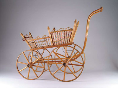 Appraisal: WICKER DOLL CARRIAGE Bent wood and wicker carriage lined with