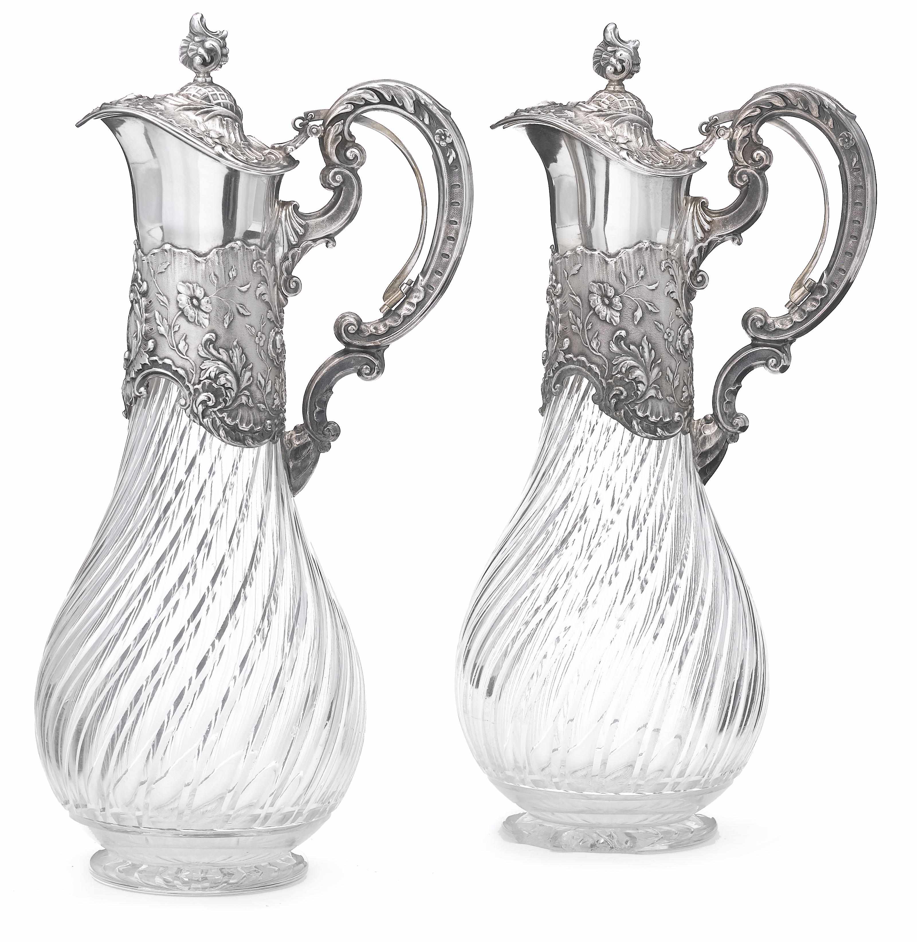 Appraisal: A German standard silver and glass pair of claret jugs