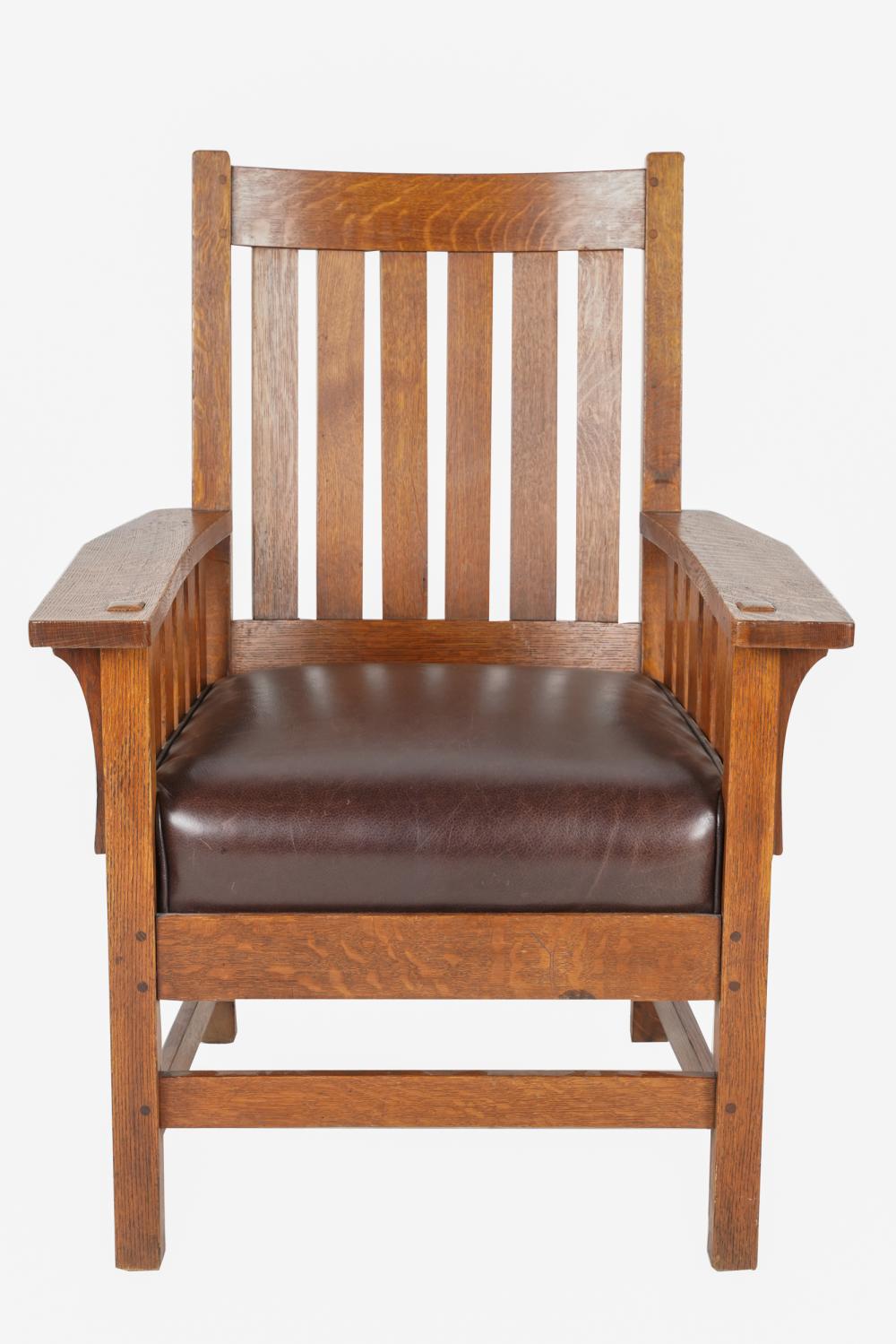 Appraisal: L J G STICKLEY OAK ARMCHAIRwith rectangular white decal The