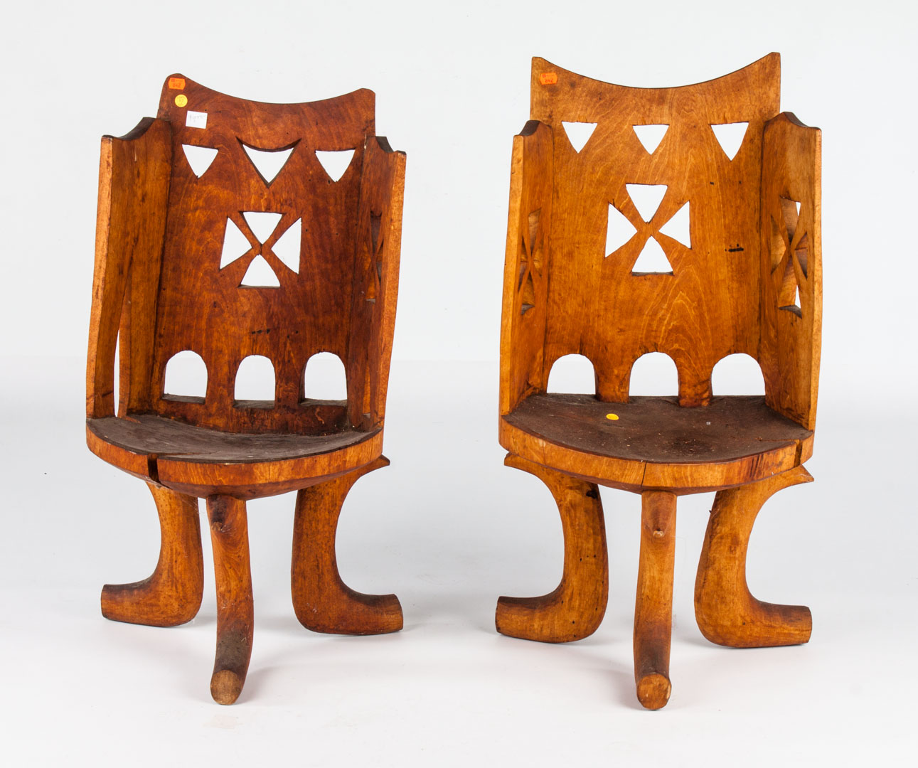 Appraisal: Two Konya chairs from Ethiopia each carved from a single