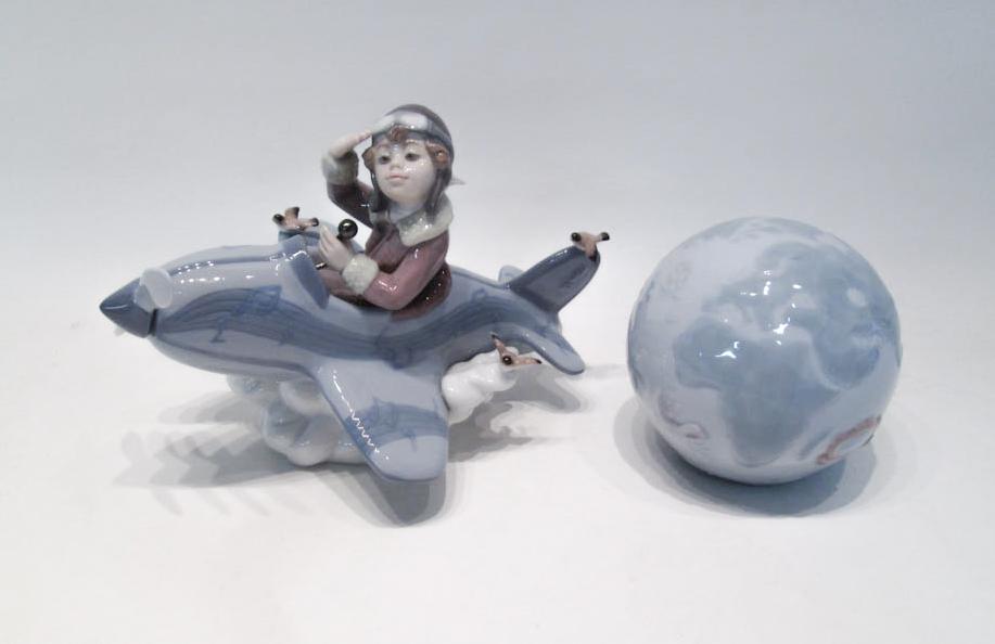 Appraisal: TWO LLADRO PORCELAINS Over the Clouds figurine issued retired and