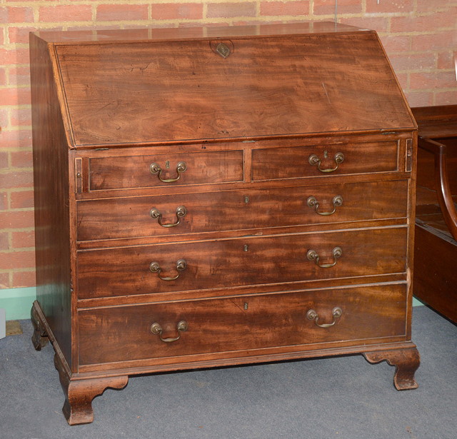 Appraisal: A GEORGE III MAHOGANY BUREAU the interior fitted a central