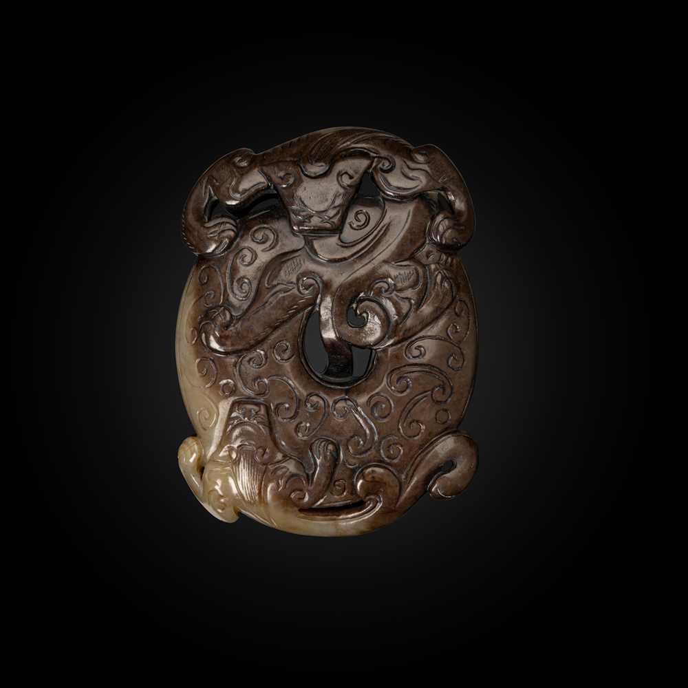 Appraisal: CELADON AND BROWN JADE 'DRAGON' DISC-FORM PENDANT MING DYNASTY the