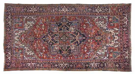 Appraisal: A Heriz Wool Rug having a geometric center medallion on