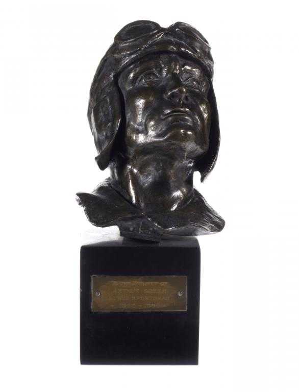 Appraisal: MOTOR RACING A BRONZE BUST OF JUAN MANUEL FANGIO -