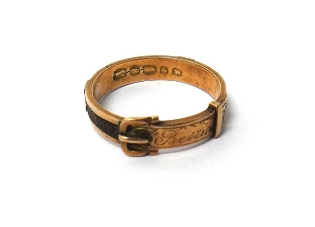 Appraisal: A gold and hairwork mourning ring designed as a buckle