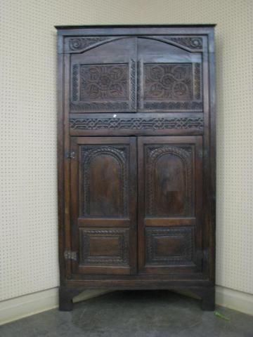 Appraisal: Late th century English corner cupboard with four blind doors