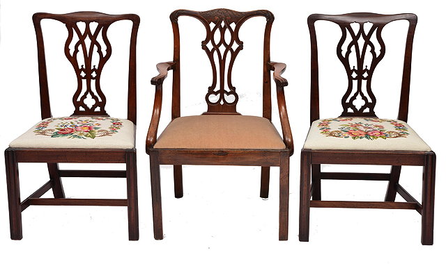 Appraisal: A CHIPPENDALE STYLE MAHOGANY RIBBON SPLAT ARMCHAIR with drop in