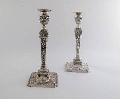 Appraisal: Pair of late Victorian candlesticks neo classical style with canted