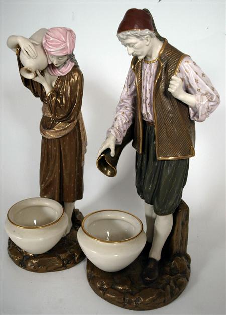 Appraisal: A pair of Royal Worcester figures of Eastern water carriers