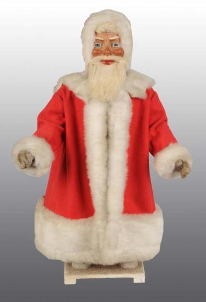 Appraisal: Santa Christmas Wind-Up Nodder Description Glass eyes with rabbit fur