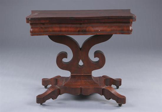 Appraisal: LATE EMPIRE PILLAR-AND-SCROLL GAMING TABLE th century mahogany Serpentine facade