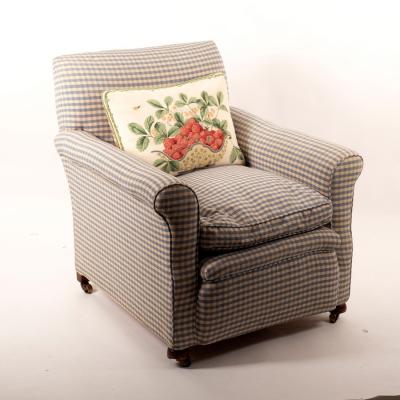 Appraisal: An Edwardian upholstered armchair the short feet on castors