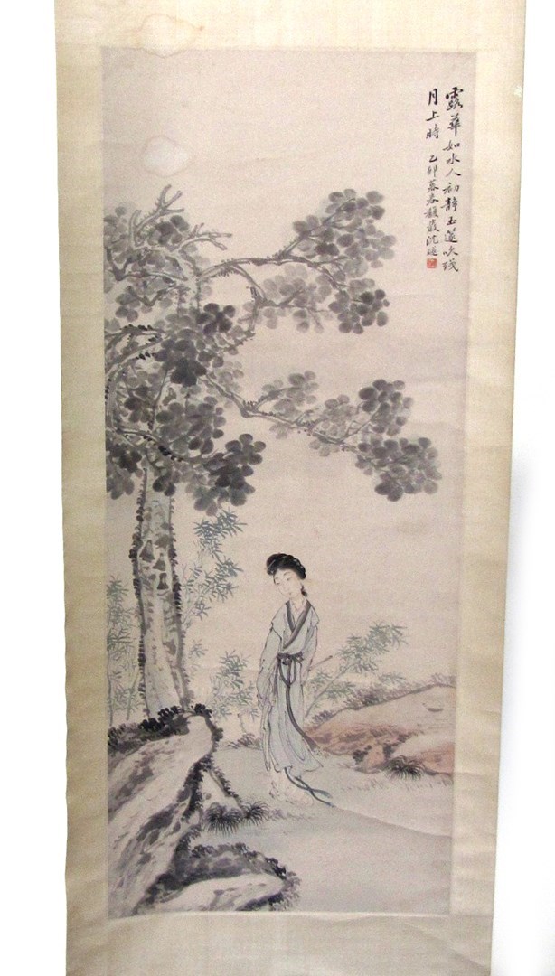 Appraisal: A Chinese scroll painting of a lady standing in a