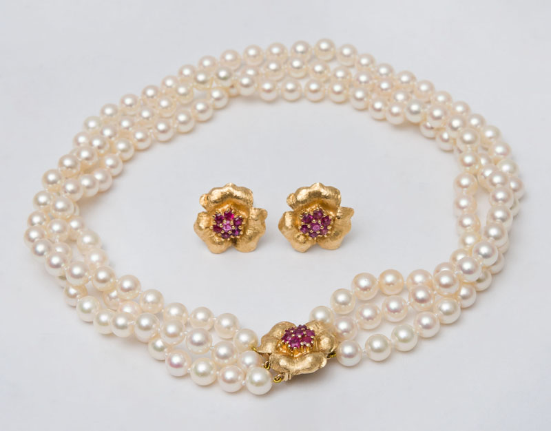 Appraisal: THREE STRAND PEARL NECKLACE WITH GOLD AND RUBY CLASP AND