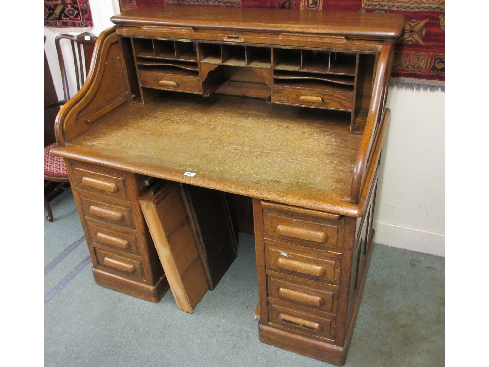 Appraisal: An oak roll top desk