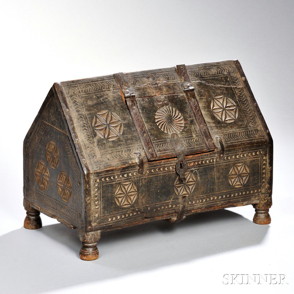 Appraisal: Iron-bound Carved Oak Chest Continental th century with carved pinwheels