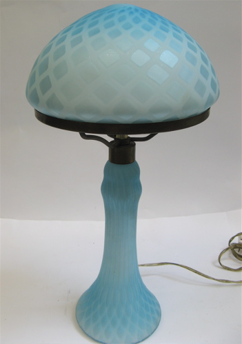 Appraisal: A QUILTED BLUE SATIN ART GLASS TABLE LAMP having a