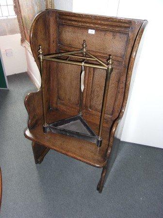 Appraisal: A TH CENTURY STYLE OAK PANELLED HALL CHAIR with wing