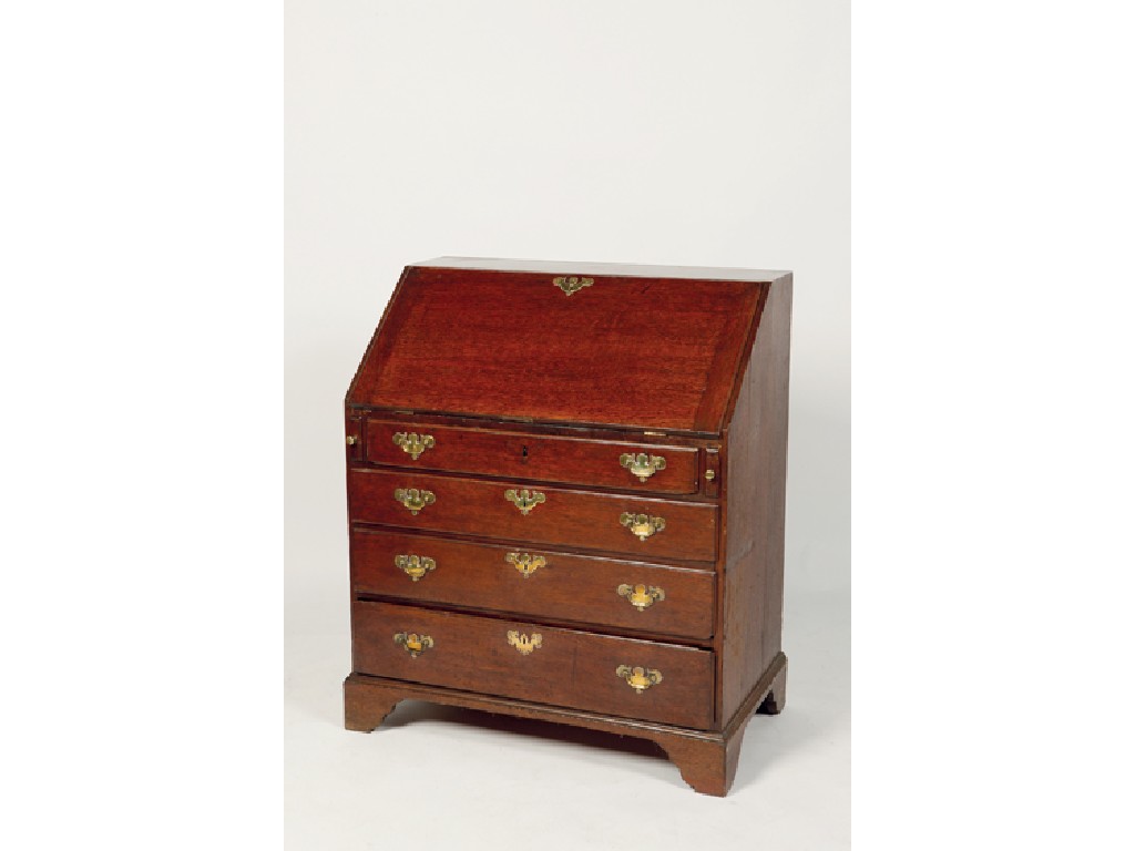 Appraisal: A GEORGE III OAK BUREAU the sloping fall enclosing a