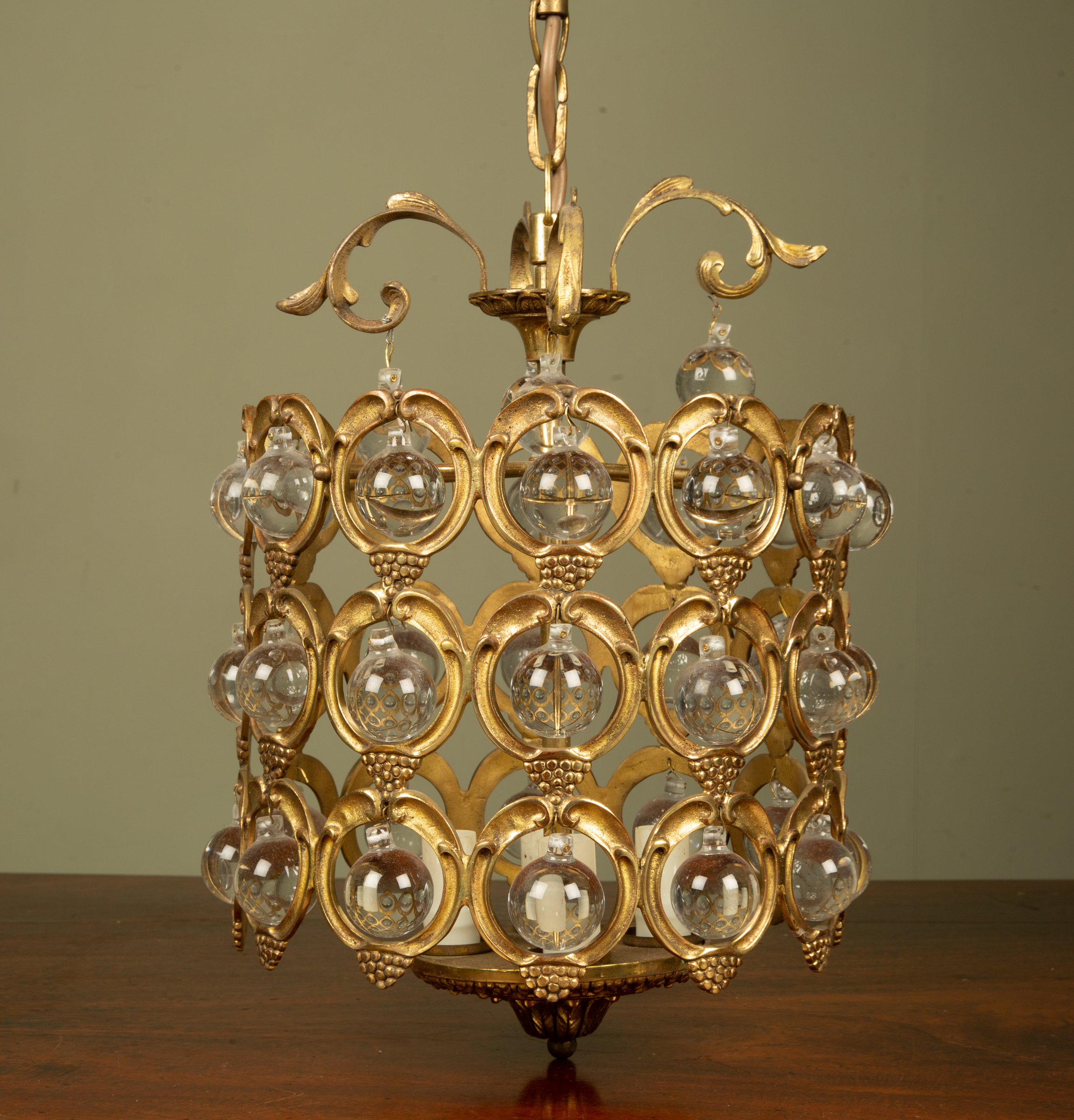 Appraisal: A gilt metal pendant or hanging light with spherical glass