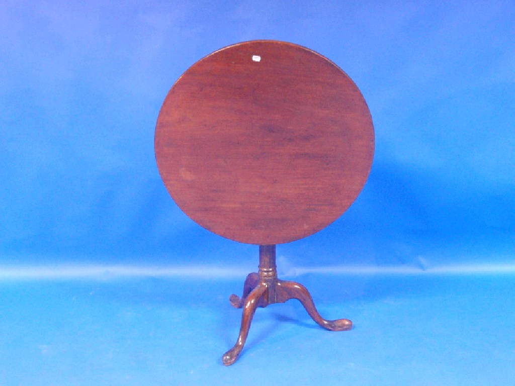 Appraisal: An thC circular mahogany tripod table with tip-up top on