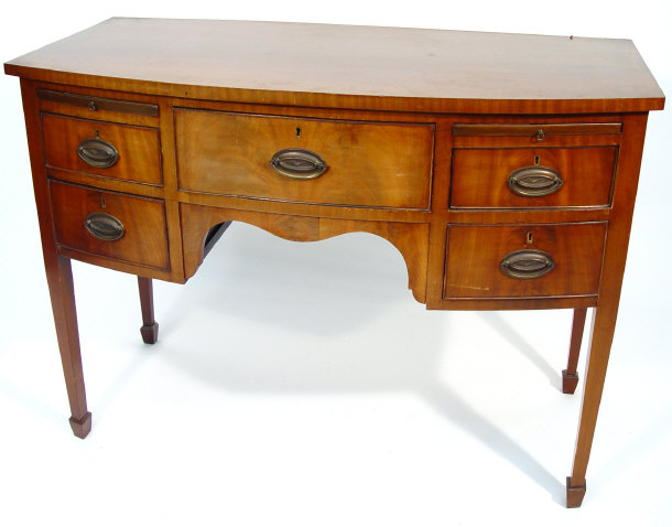 Appraisal: th century mahogany bow fronted sideboard the central drawer flanked