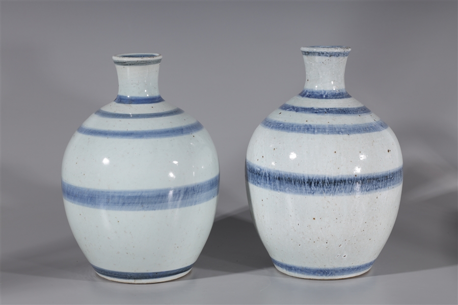 Appraisal: Two Chinese porcelain vases each with white glaze with cobalt