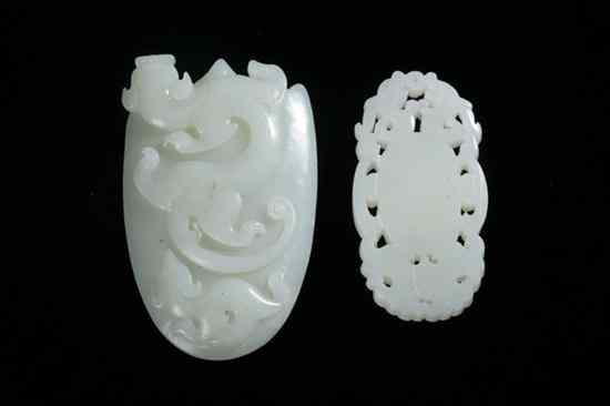 Appraisal: TWO CHINESE CELADON JADE CARVINGS Carved to depict a dragon