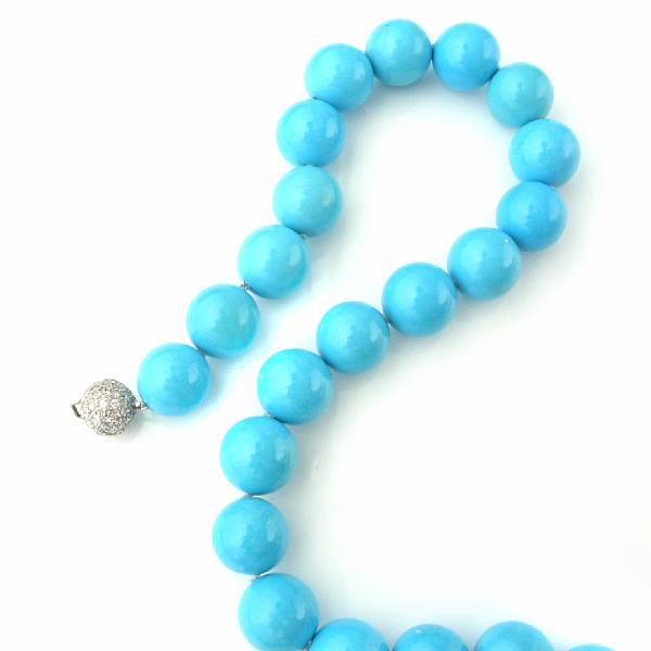 Appraisal: A turquoise bead necklace with diamond and fourteen karat white