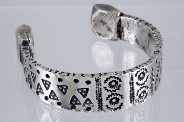 Appraisal: Heavy cast silver bracelet unmarked wide Stamped with various designs