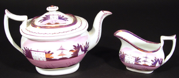 Appraisal: Victorian china teapot and cream jug each decorated with pink