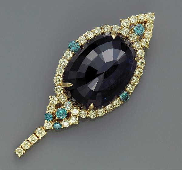 Appraisal: A sapphire diamond and colored diamond pendant enhancer centering an