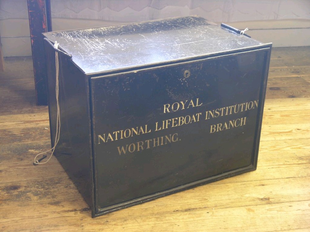 Appraisal: A painted tin deed box 'Royal National Lifeboat Institution Worthing