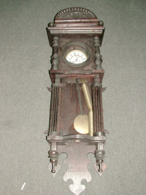 Appraisal: A Continental regulator type wall clock the ornate wooden case