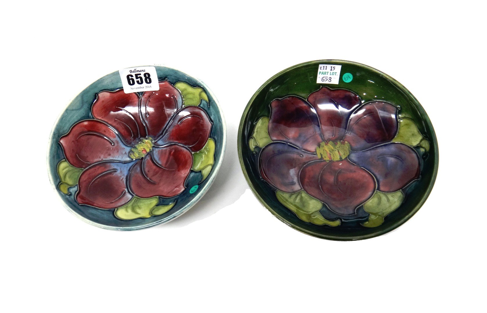 Appraisal: Two Moorcroft 'Anemone' green ground shallow bowls mid th century