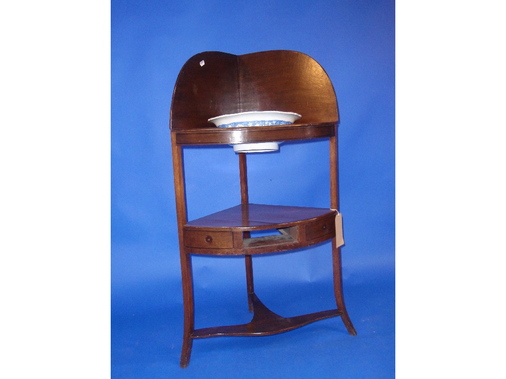 Appraisal: A Georgian mahogany corner washstand with bowl