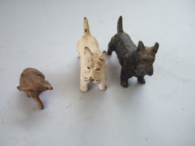 Appraisal: Two hollowcast painted lead Scottie dogs and a hollowcast rabbit