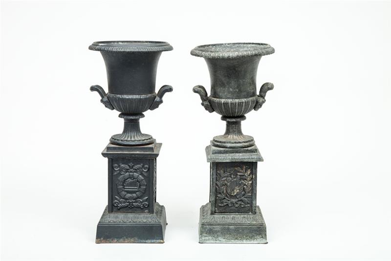 Appraisal: Two Similar Neoclassical Style Cast-Iron Mantel Urns x in Property