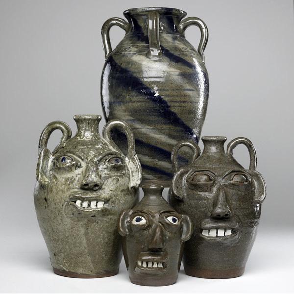 Appraisal: BURLON CRAIG Four Folk Art vessels three face jugs and