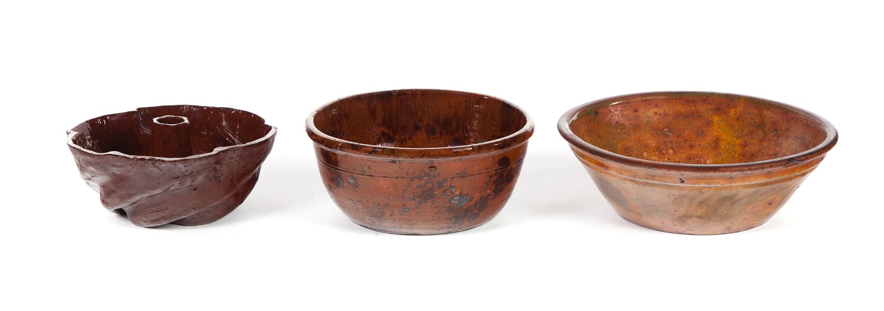 Appraisal: THREE PIECES OF REDWARE American th century Two bowls and