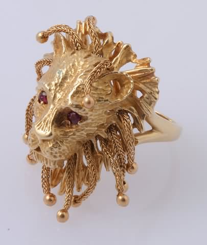 Appraisal: KY Lion's head with mm ruby eyes and gold dangles