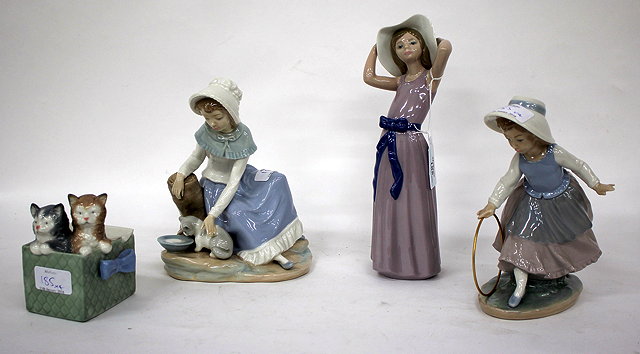 Appraisal: A LLADRO PORCELAIN FIGURINE OF A GIRL holding on a