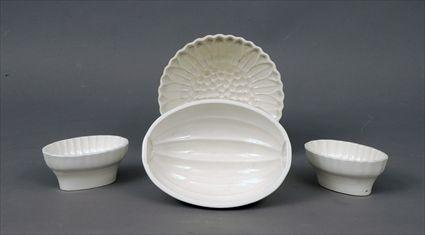 Appraisal: Four German Pottery Food Molds Marked G M T Co